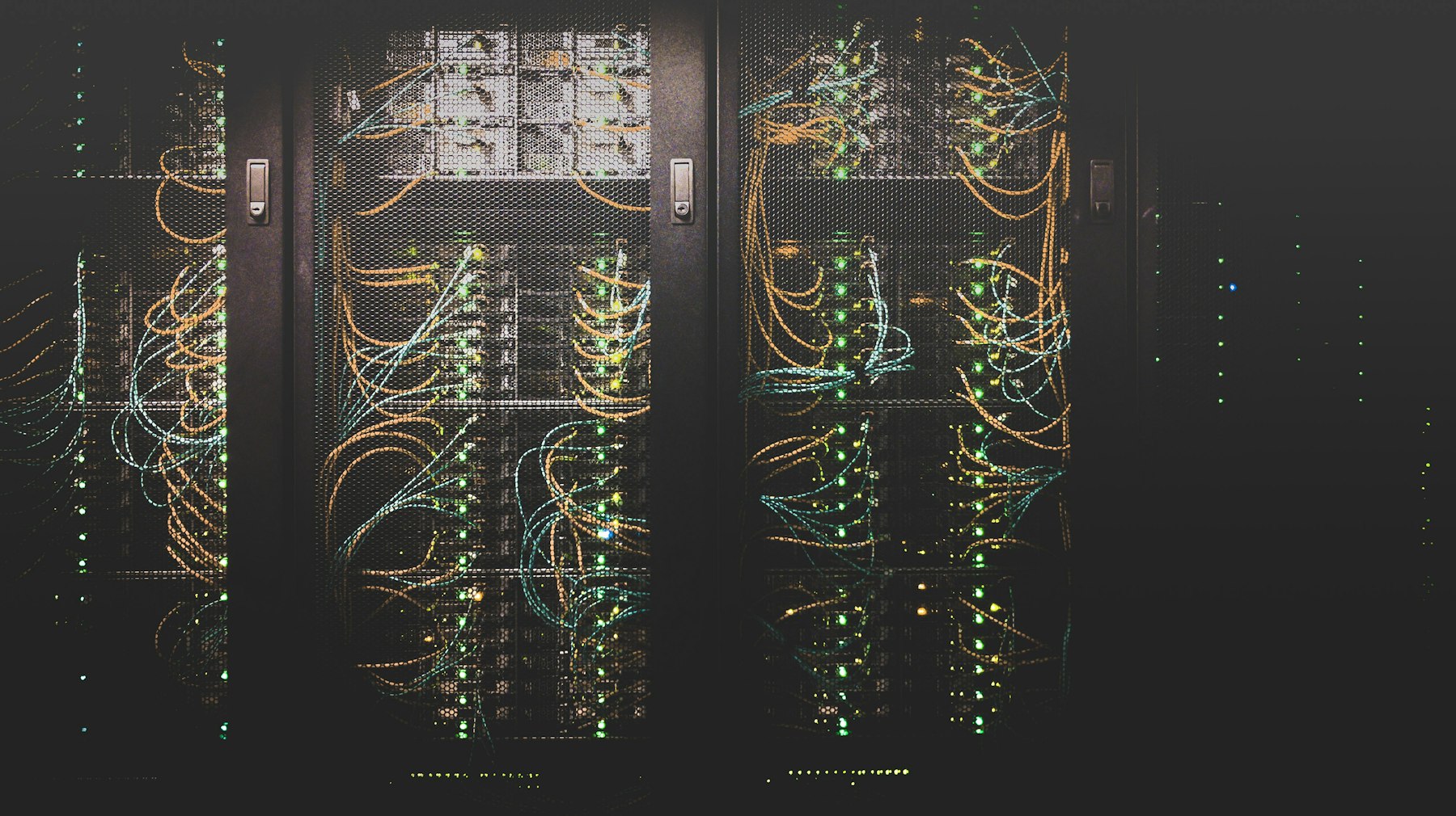 Server racks with network cabling inside a data center